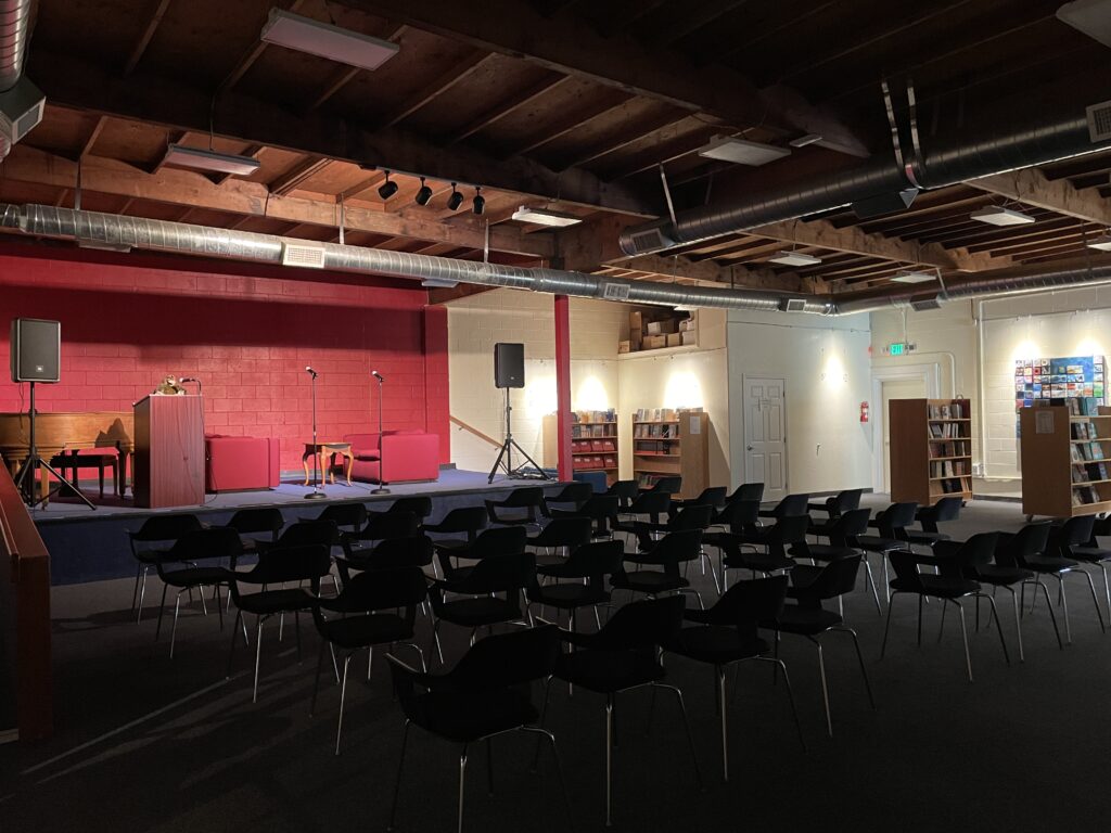 Our event space staged with rows of chairs facing the stage.